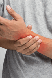 Physical therapist helping patient move comfortably without pain