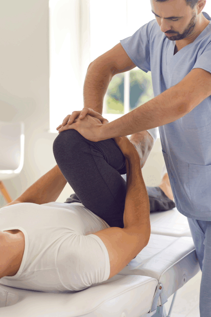 Athlete high-fiving a physical therapist in the clinic