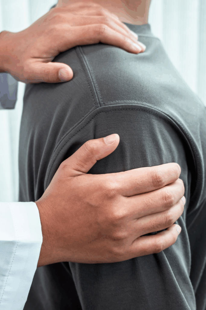 Patient talking with a therapist during a physical therapy evaluation.
