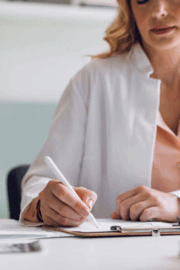 Patient holding referral form unsure about physical therapy options