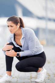 Athlete evaluating leg discomfort after exercise.