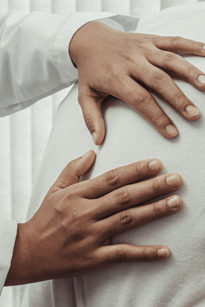 Physical therapist guiding patient through recovery stretches.