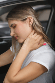 Person experiencing neck pain caused by stress.