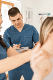 Patient doing range of motion test with PT in clinic