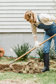 Maine resident raking colorful fall leaves in Brunswick