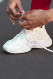 Runner lacing up supportive sneakers