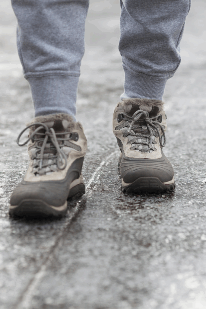 Southern Maine resident walking carefully on icy sidewalk