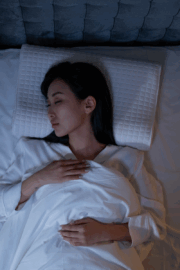 New mattress with supportive pillows on bed