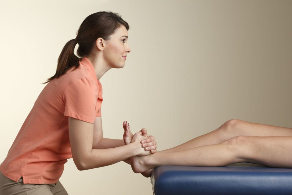 physical therapist performing manual therapy