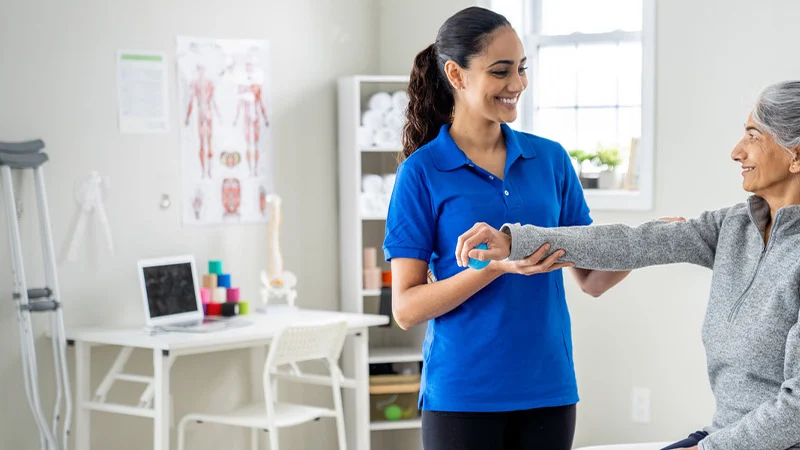 one-on-one physical therapy session with patient and therapist