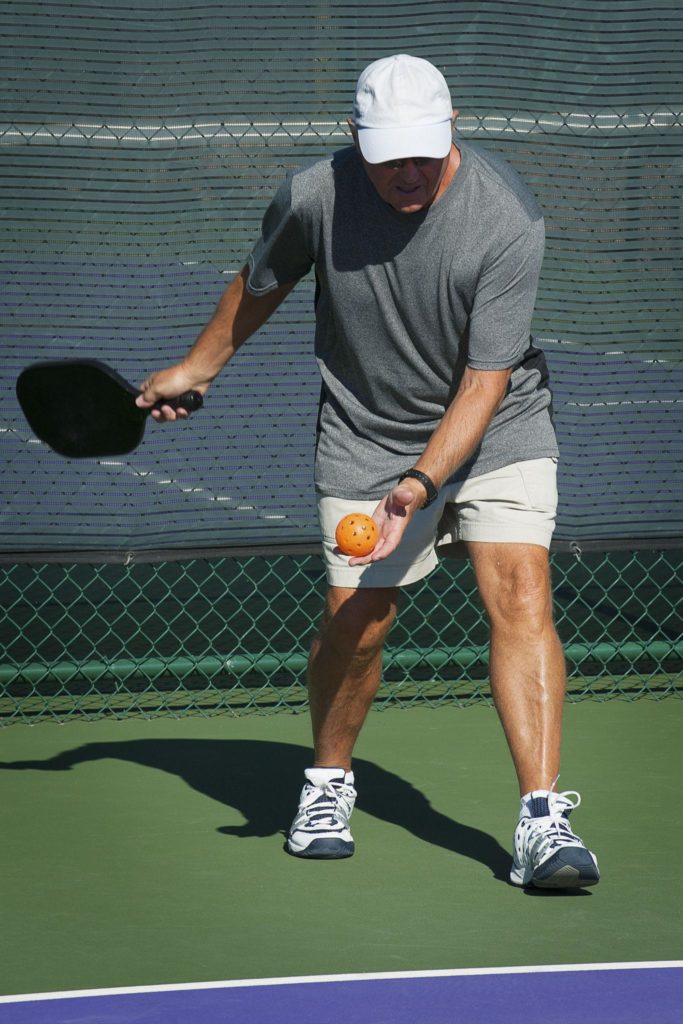 pickleball players warming up before game for pain-free pickleball prep